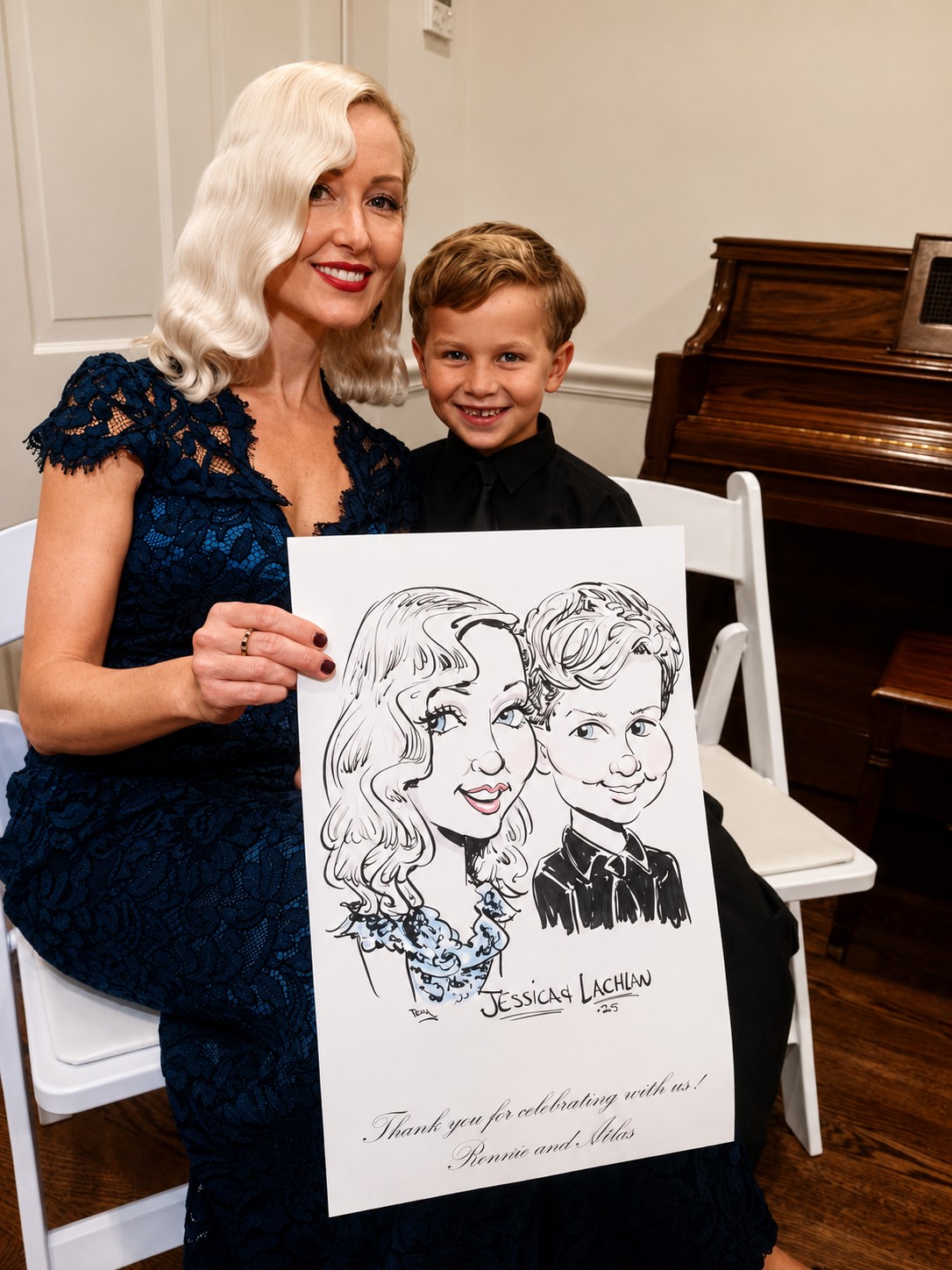 Mother and son holding a duo caricature at a family celebration