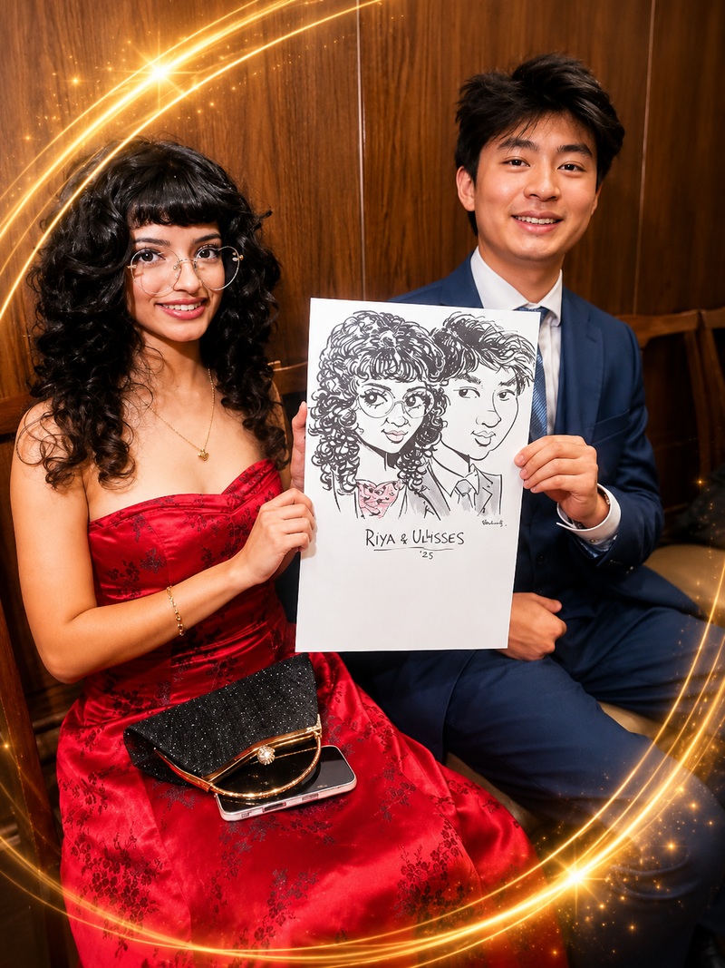 Prom couple in red and navy holding a duo caricature keepsake