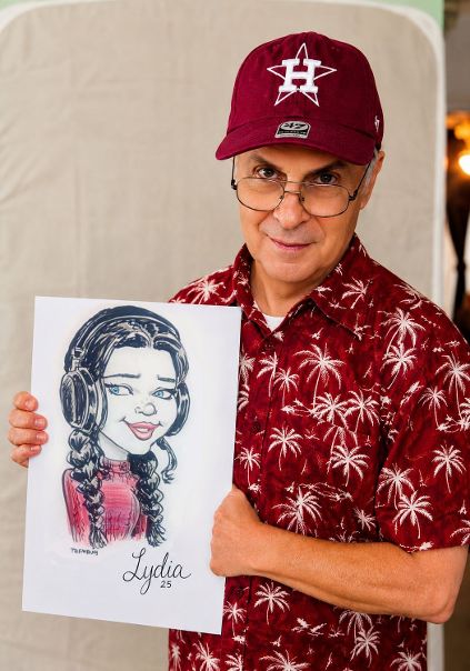 Caricature artist Martin Tremblay with a live caricature of Lydia