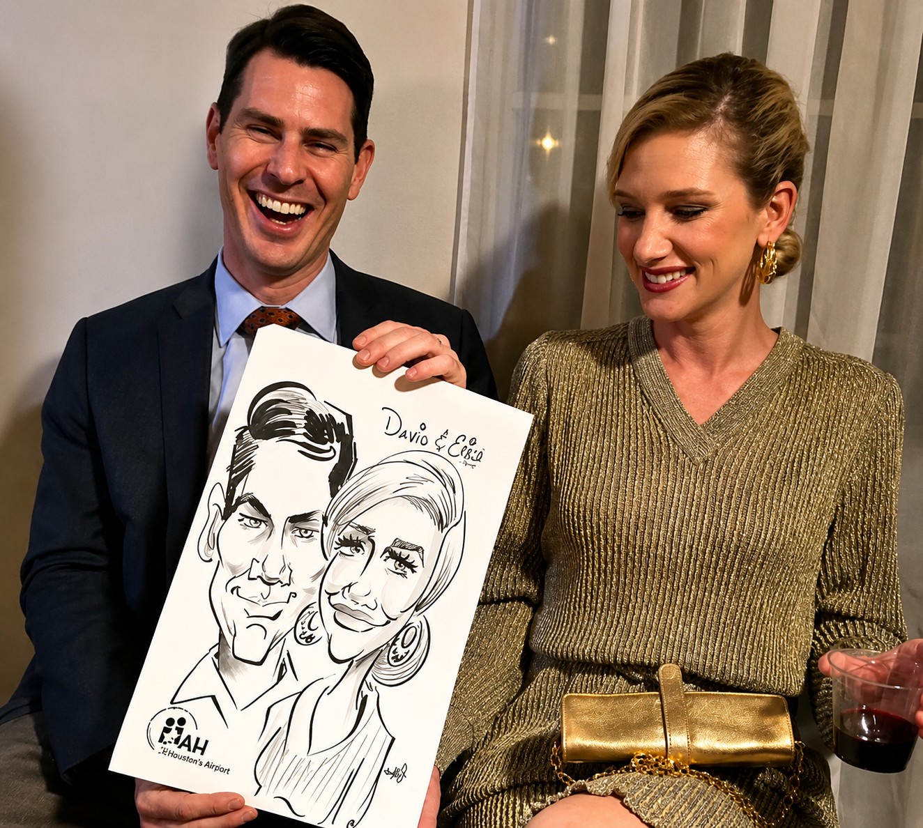 Couple laughing while holding a black-and-white duo caricature by Jody