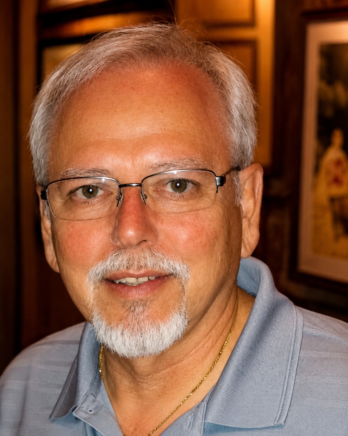 Portrait of Eddie, a caricature artist with glasses and a goatee