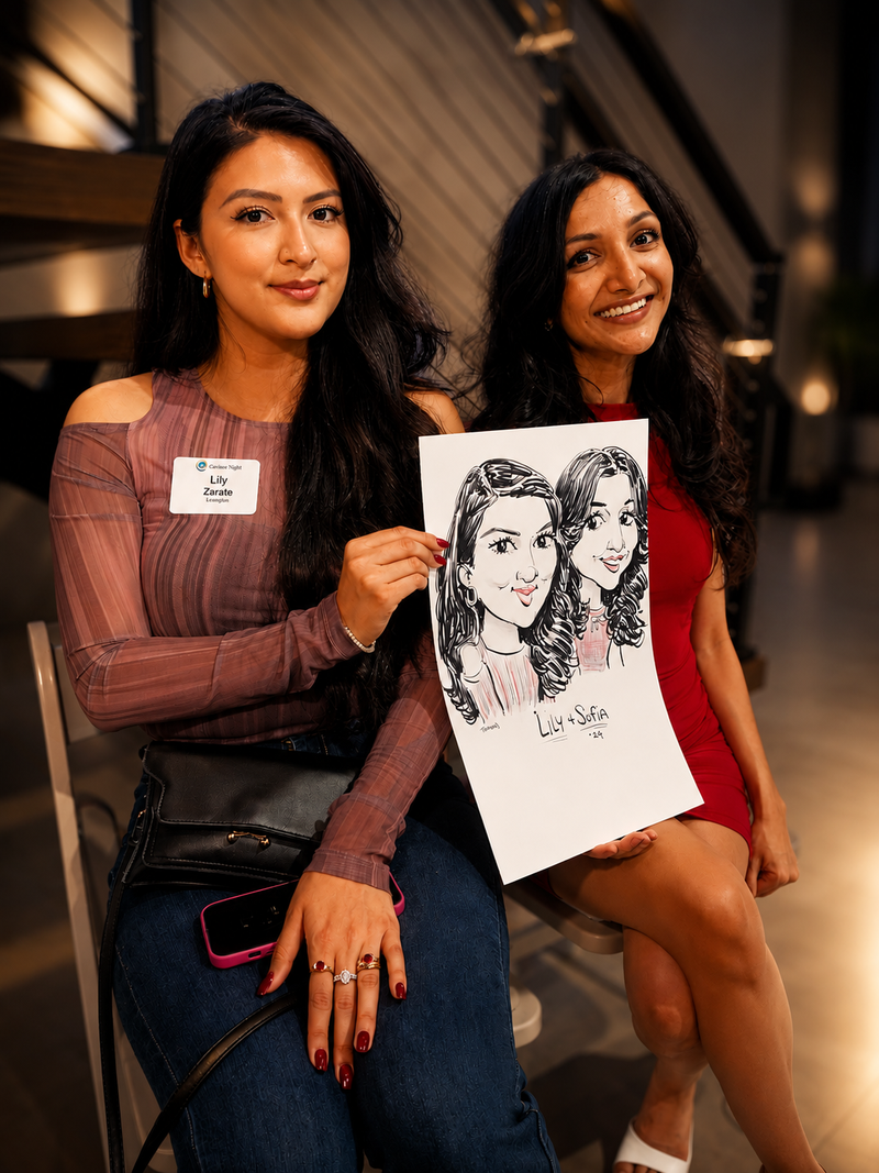 Two colleagues holding a duo caricature at a corporate networking night